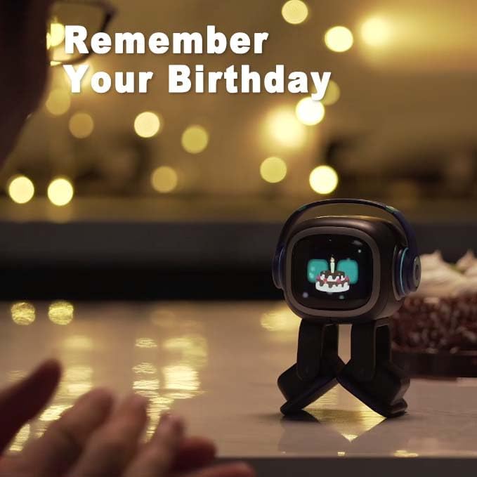 Emo ChatGPT-Enabled AI Desk Robot Companion reminding user of their birthday with expressive face and festive background.