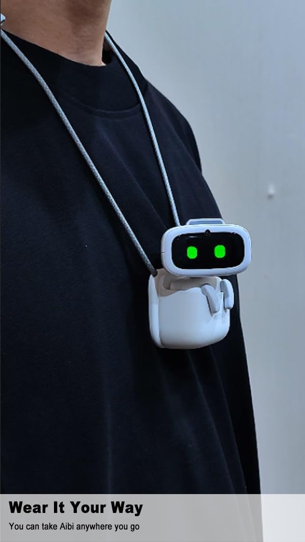 Ultra-portable wearable robot worn as a hands-free companion on a person's chest with green lights.