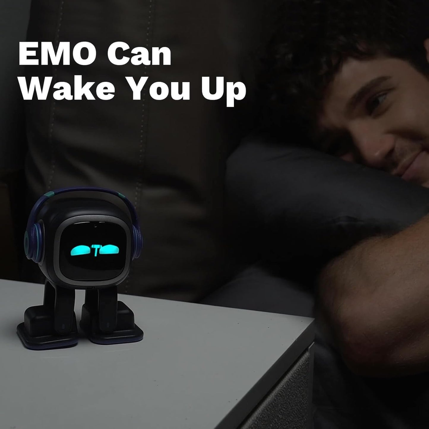 Emo ChatGPT-Enabled AI Desk Robot Companion helping wake up user with expressive face and headphones.