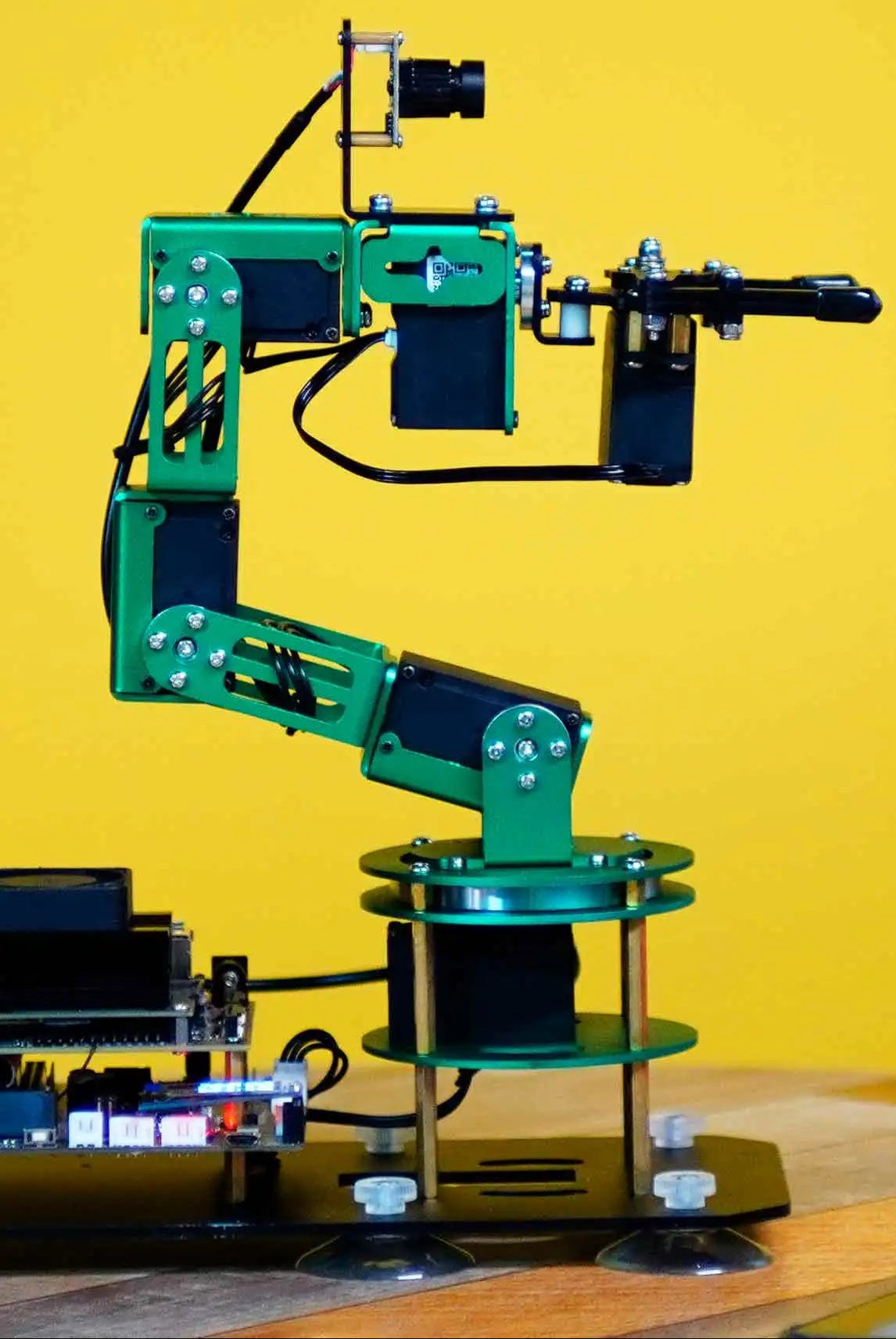 AI robotic arm kit showcasing precise motion and versatile attachments for engineering projects.