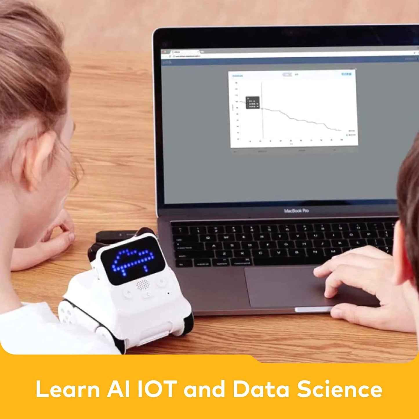 coding robot toy for children being used alongside a laptop for learning AI, IoT, and data science.