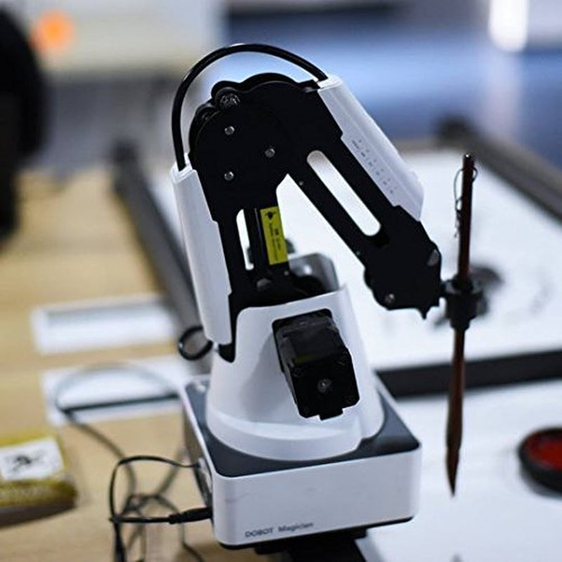 K12 STEM educational magician kit with robotic arm demonstrating coding principles and hands-on learning.