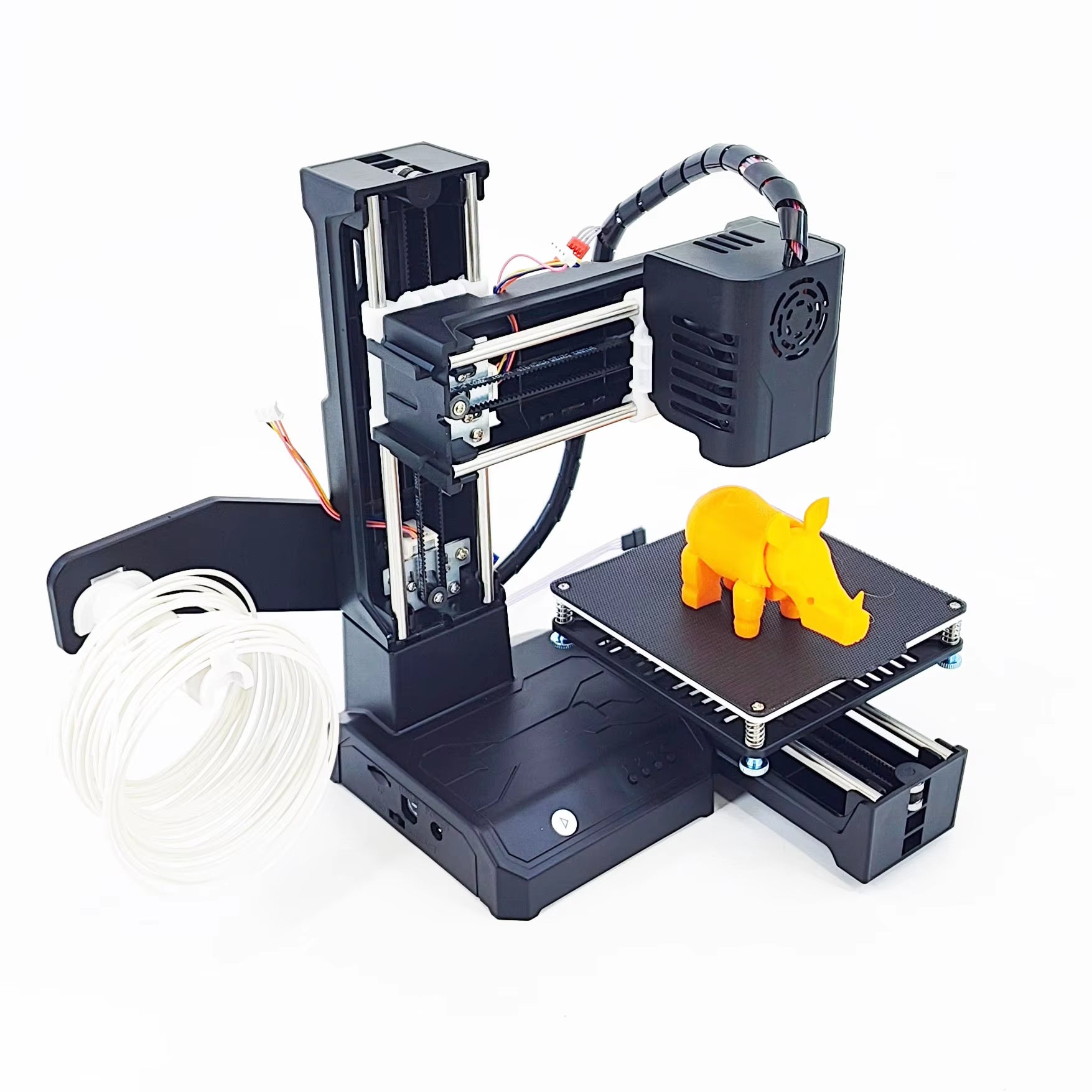 entry-level Mini 3D printer producing a vibrant yellow elephant model on a smooth surface.